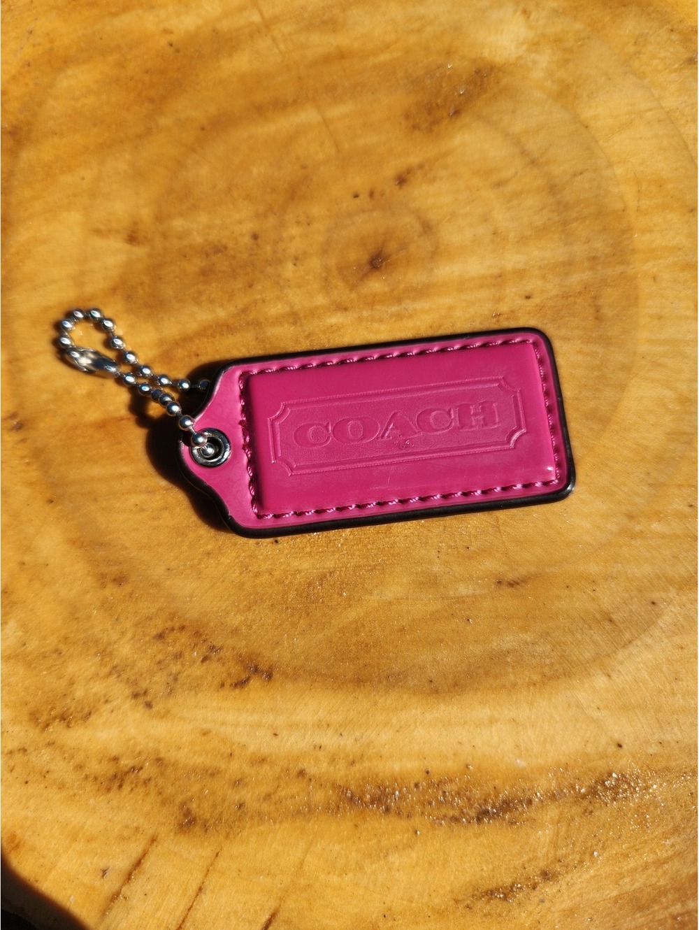 Coach pink leather hang tag